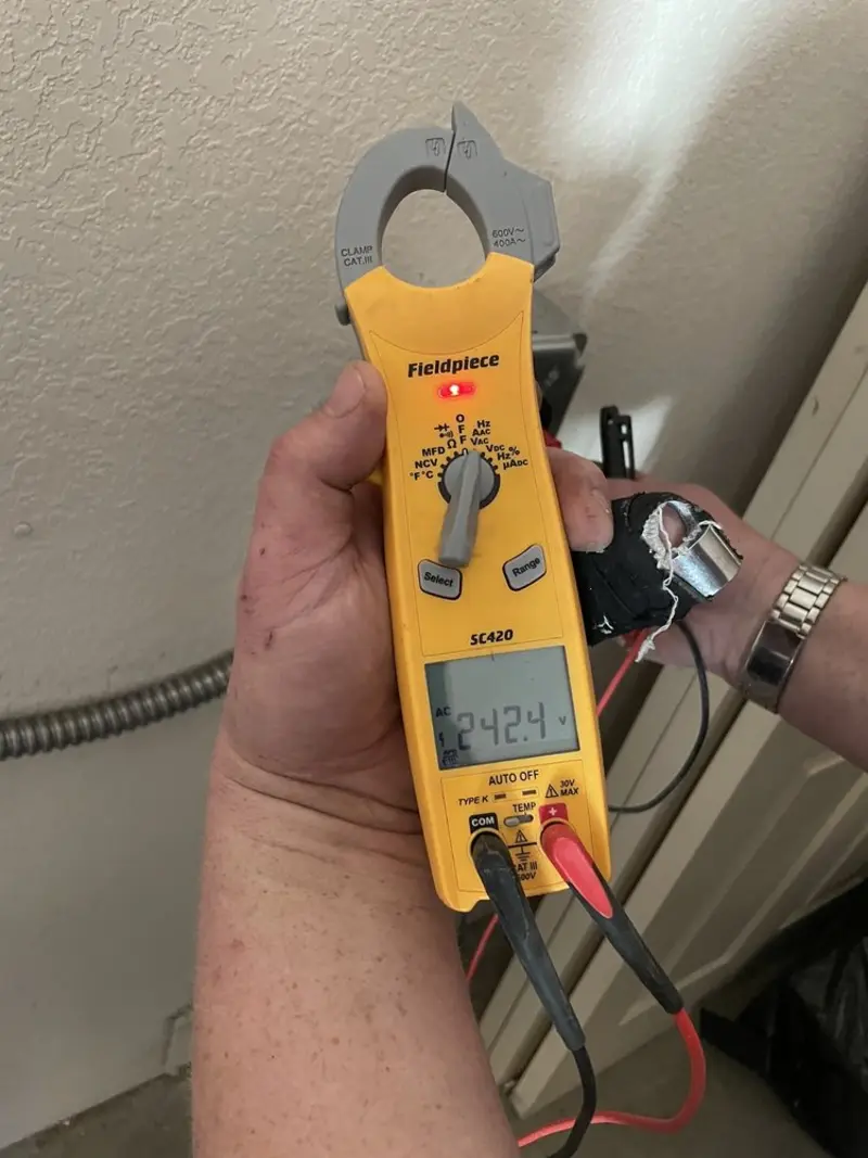 Voltage testing with clamp meter during Outlet Installation in Sugar Land